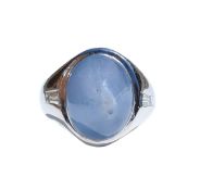 A cabochon cut star sapphire and diamond cocktail ring