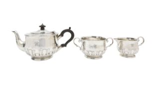 An Arts & Crafts silver three piece tea service