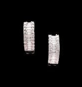 A pair of 18ct diamond half hoop earrings
