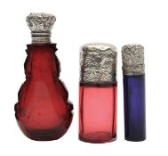 Three Victorian silver mounted scent bottles