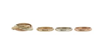 A three colour 9ct gold Russian wedding ring and three others