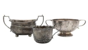 Two George V silver sugar bowls, and a teacup