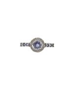 A diamond and tanzanite halo ring