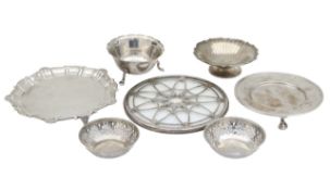 A collection of silver trays and dishes