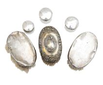 Three silver mounted brushes, and three glass jars