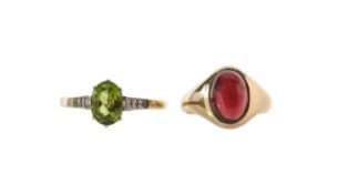 A peridot dress ring and garnet signet ring