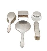 A George V silver mounted six piece dressing table set
