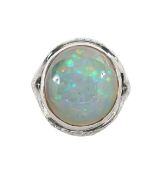 A large opal and diamond dress ring