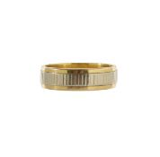 A textured bi-colored wedding band
