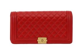 A Chanel 'Boy' red lambskin flap clutch bag