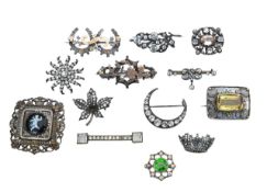 A collection of Victorian and later costume brooches