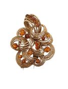 A Hans Georg Mautner 9ct gold citrine set flower brooch