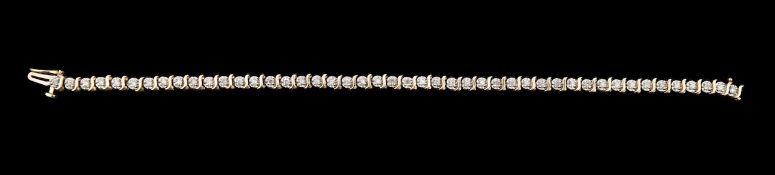 A 9ct gold and diamond tennis bracelet