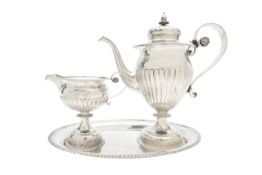 A silver three piece coffee service