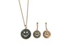 A 'smiley face' pendant and earring set