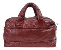 A Chanel 'Cocoon' oxblood lambskin holdall
