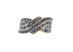 A blue sapphire cross over ring