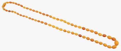A long graduated butterscotch amber necklace