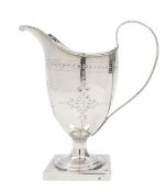 A silver helmet form cream jug