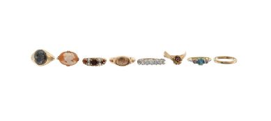 A collection of eight gold rings