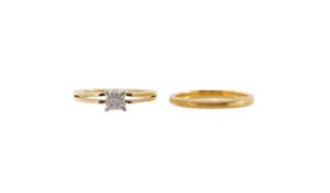 A 22ct gold wedding band and a diamond set solitaire