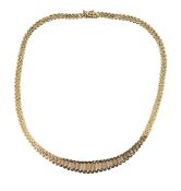 A 1970s textured tricolour gold articulated necklace