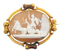 A large cameo brooch set within a gold frame