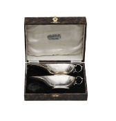 A cased pair of Art Deco silver sauceboats