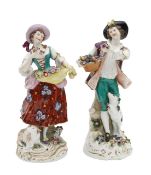 A pair of Chelsea style porcelain figures