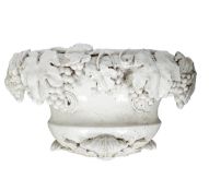A large white glazed terracotta wall jardinière