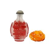 An overlay glass Chinese snuff bottle and amber pendant