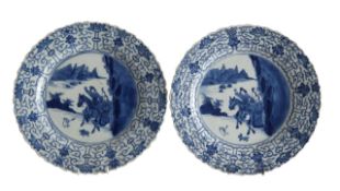 A pair of Chinese blue and white porcelain 'Love Chase' dishes