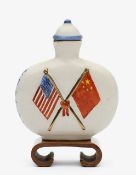 A ceramic commemorative Chinese snuff bottle