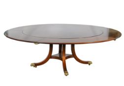 A large Georgian style mahogany extending dining table