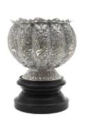A large Indian silvered bowl on stand