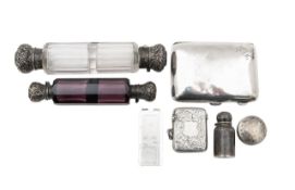 A collection of silver boxes, scent bottles and a money clip