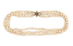 A 9ct gold clasped three row baroque pearl necklace