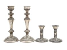 Two pairs of silver candlesticks