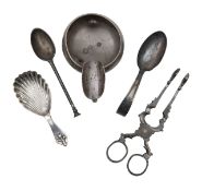 A pair of Irish silver sugar nips, three silver spoons and an ashtray