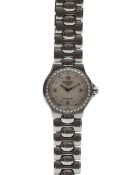 A Longines 'Conquest' stainless steel and diamond inset lady's wristwatch