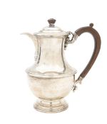A silver hot water jug