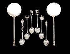 A cased pair of George V silver seal top spoons, and Indian teaspoons