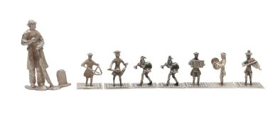 A group of seven Continental figures and an English silver menu holder