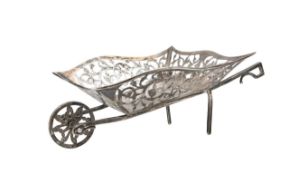 An Edwardian silver novelty wheelbarrow bon bon dish