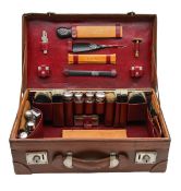 An Edwardian leather gentleman's silver topped valet suitcase