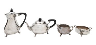 An Arts & Crafts silver four piece tea service