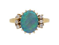 A black opal and diamond ring