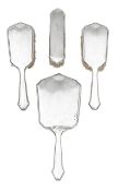 An Art Deco silver four piece dressing table set