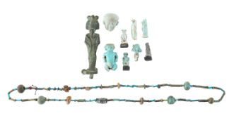 An Egyptian bronze figure of Osiris, faience amulets and a necklace