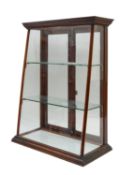A walnut shop display cabinet
